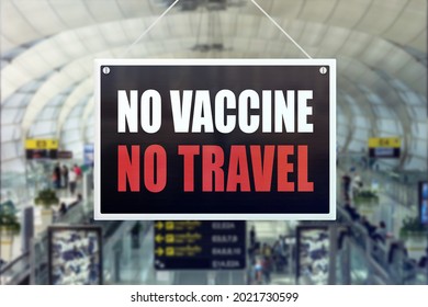 A No Vaccine No Travel sign at an airport terminal. Vaccination requirement for travel concept. - Shutterstock ID 2021730599