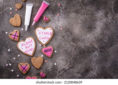 No Valentines Day Concept. Cookies Hearts With Text Alone But Happy And Stupid Cupid