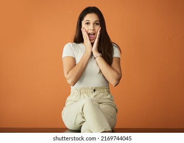 No Way. Cropped Portrait Of An Attractive Young Woman Posing In Studio Against An Orange Background.