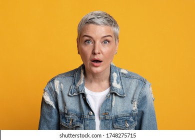 No Way. Portrait Of Shocked Middle Aged Woman Opened Mouth In Amazement, Standing Over Yellow Background, Free Space.