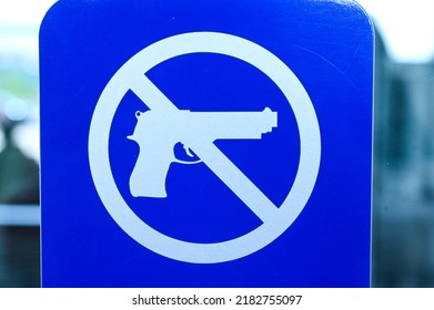 No Weapons Sign. No Guns Icon. Blue And White Prohibition Symbol. 