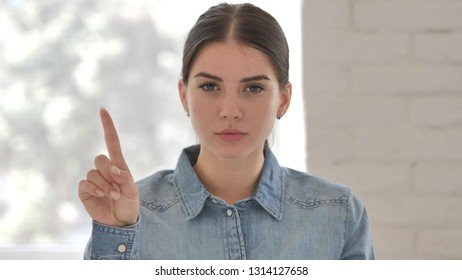 No, Young Girl Rejecting Offer By Waving Finger