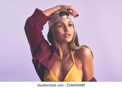 No, Youre Not Dreaming, You Really Are That Beautiful. Studio Shot Of A Beautiful Young Woman Posing Against A Purple Background.