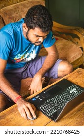 Noakhali, Bangladesh- September 30,2022 : South Asian Young Male Working With Laptop From Home. 