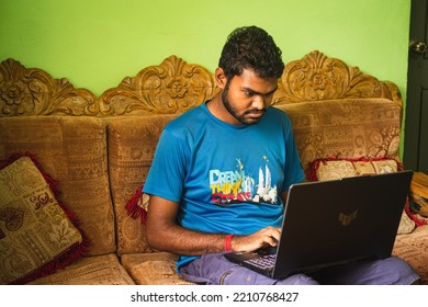 Noakhali, Bangladesh- September 30,2022 : South Asian Young Male Working With Laptop From Home. 