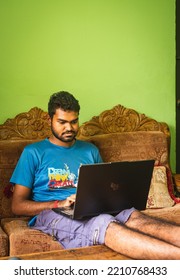 Noakhali, Bangladesh- September 30,2022 : South Asian Young Male Working With Laptop From Home. 