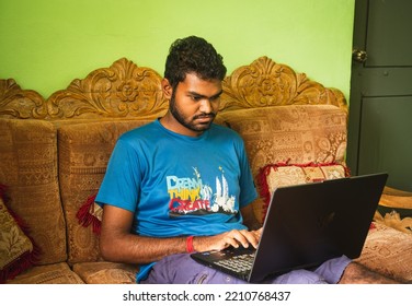 Noakhali, Bangladesh- September 30,2022 : South Asian Young Male Working With Laptop From Home. 