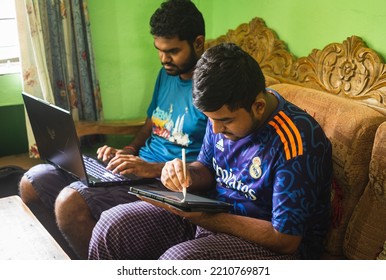 Noakhali, Bangladesh- September 30,2022 : South Asian Young Brothers Working With Laptop And Tablet From Home