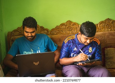 Noakhali, Bangladesh- September 30,2022 : South Asian Young Brothers Working With Laptop And Tablet From Home