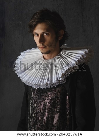 A noble young man in an old suit with a round Spanish collar, a portrait in the style of Renaissance paintings