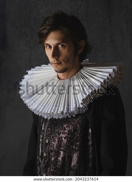 A noble\
young man in an old suit with a round Spanish collar, a portrait in\
the style of Renaissance\
paintings