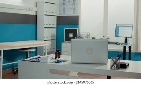 Nobody In Doctor Office With Medical Equipment And Instruments, Space Used For Checkup Visit Appointments. No People In Empty Cabinet With Health Care Service Technology For Recovery.