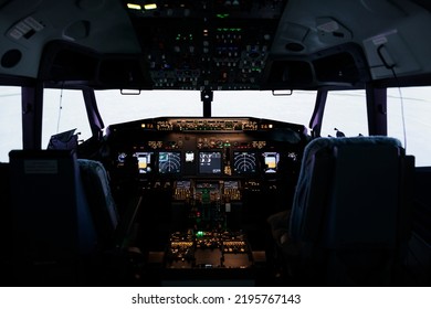 Nobody In Empty Captain Cabin Used To Fly Airplane With Dashboard Command And Control Panel Navigation. Throttling Engine Lever And Flying Jet With Buttons, Power Switch And Handle.