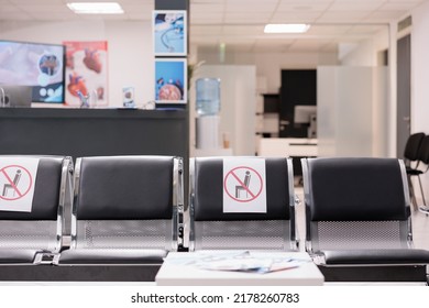 Nobody In Empty Hospital Reception Waiting Area, Medical Facility With Healthcare Service To Cure Patients With Disease. No People In Clinic Lobby Waiting Room During Covid 19 Pandemic.