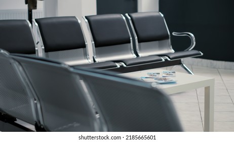 Nobody On Empty Chairs In Waiting Room Lobby At Medical Facility, Hospital Reception With Seats In Waiting Area For Checkup Visit Appointments. Clinic Hall For Consultation And Examination.