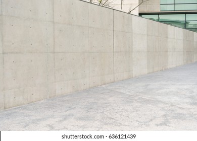 Nobody Photo Of Outdoor Empty Gray Concrete Wall At Reflection Windows Modern Building Office Outside In Prosperous City With Sidewalks Background.