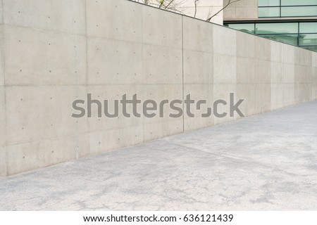 nobody photo of outdoor empty gray concrete wall at reflection windows modern building office outside in prosperous city with sidewalks background.