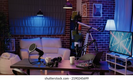 Nobody In Podcast Production Studio With Professional Microphone And Headphones For Streaming Interview On Internet Radio. Empty Desk With Streaming Equipment To Broadcast Live Show On Social Media.