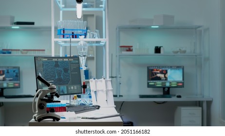 Nobody in scientific laboratory with research instruments for healthcare treatment innovation. Empty room of biochemistry labware with computer, test tube, microscope used in development