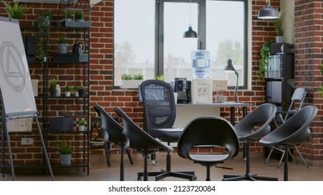 Nobody In Space With Chairs In Circle And Aa Meeting Sign On White Board. Empty Office Used For Group Therapy Session With People And Psychotherapist For Rehabilitation Program.