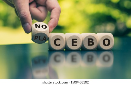 Nocebo or placebo? Hand turns a cube and changes the word 