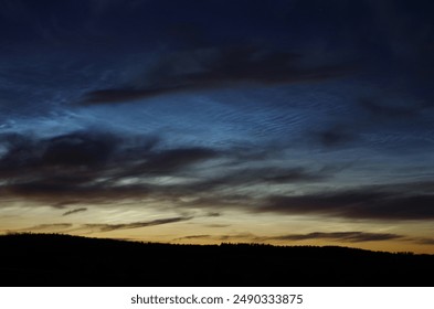 Noctilucent clouds 2024, summer solstice. - Powered by Shutterstock