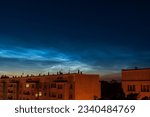 Noctilucent clouds, or night shining clouds in city.