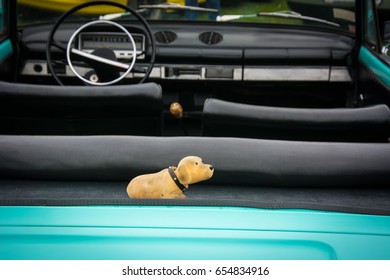 Nodding Dog In A Turquoise Retro Car 