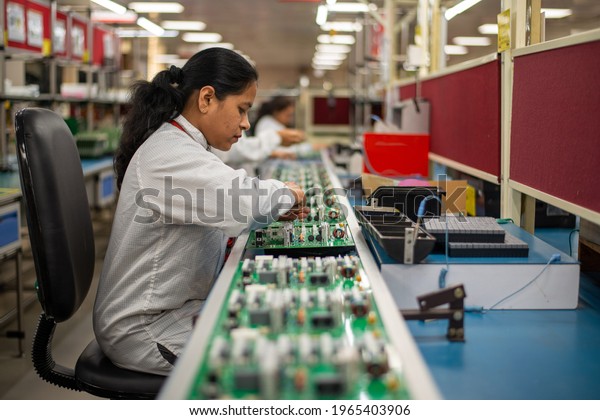 Noida,
Uttar Pradesh, India- 17 January 2020: woman Engineer or Technician
making circuit board in a factory. Technological process, 
Manufacturing Engineering Industrial worker
woman.