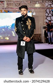 NOIDA, UTTAR PRADESH, INDIA - JULY 2021: Indian Male Model Standing On Stage In Designer Clothes While Participating In The Fashion Show.