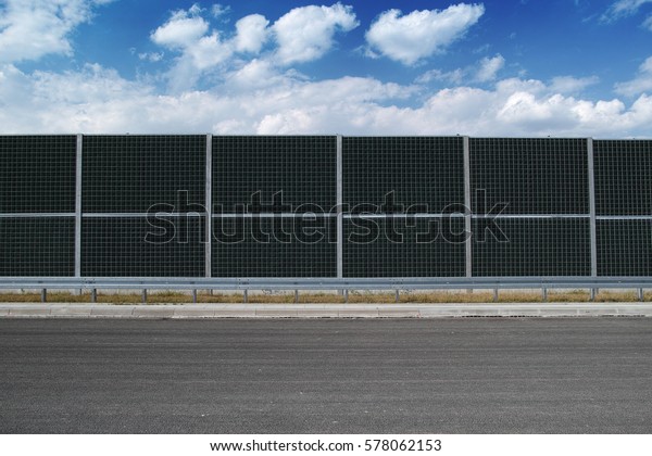 Noise barrier on a\
highway