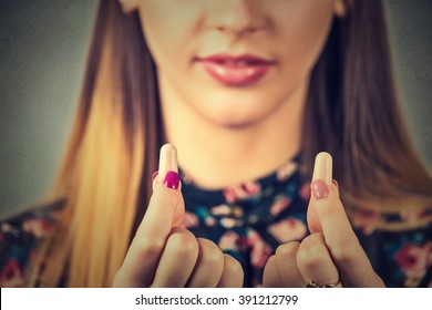 Noise Control. Young Woman With Ear Plugs Isolated On Gray Wall Background  