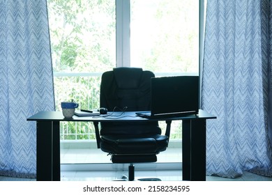 A Noise Effect And Silhouette Picture Of Simple Office With Table,laptop, Notebook, Coffee Cup, Chair And Big Sliding Door Insight. Home Office Concept.