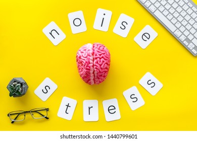 Noise And Stress Copy, Brain, Keyboard, Glasses On Yellow Office Desk Background Top View