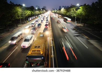 Noisy Big Highway. Traffic Jam. Nightlife And City In Lights.