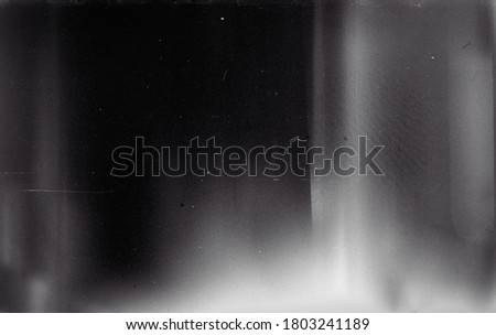 Noisy film frame with heavy noise, dust and grain. Abstract old film background