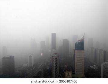Noisy Photo Of Air Pollution In A City. Aerial View