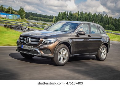 NOKIA, FINLAND - AUGUST 25, 2016: Mercedes-Benz GLC 350 e Plug-In Hybrid drives along the road. With a full battery, the Mercedes GLC 350 e reaches an electrical range of 33 km
