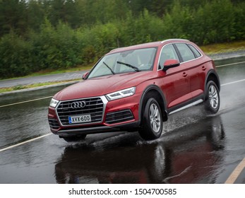 NOKIA, FINLAND - AUGUST 25, 2019: Audi Q5 35 TDI Quattro 2019 Model Year Drives On A Slippery Wet Road On A Prooving Ground During Summer SUV Tire Tests.