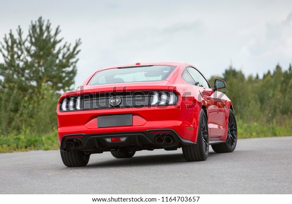 NOKIA, FINLAND -\
August 26:  Red Ford Mustang, newest model parked. Sporty legendary\
American sportscar with big black wheels. Image taken in Nokia,\
Finland on August 26,\
2018.