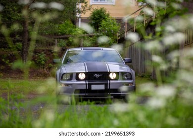 Nokia, Finland - June 22 2022. American Muscle Car Ford Mustang. Iconic And Legendary V8 Super Car With Black Stripes And High Horsepower. Gt Model Is Eight Cylinder Engine.