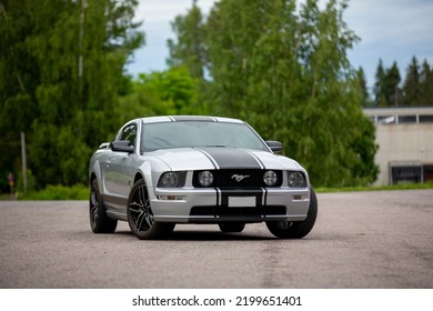 Nokia, Finland - June 22 2022. American Muscle Car Ford Mustang. Iconic And Legendary V8 Super Car With Black Stripes And High Horsepower. Gt Model Is Eight Cylinder Engine.