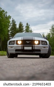 Nokia, Finland - June 22 2022. American Muscle Car Ford Mustang. Iconic And Legendary V8 Super Car With Black Stripes And High Horsepower. Gt Model Is Eight Cylinder Engine.