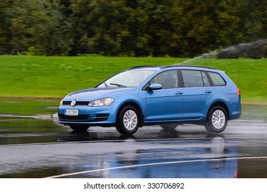 NOKIA, FINLAND - September 15, 2015: Tire Test Is Held At The Proving Ground. Professional Test-driver Performs A Wet Handling Test To Determine The Tire Which Provides The Best Grip With Wet Road.