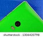 Nokia Lumia 930. Green Smartphone corner showing camera and flash on blue background, close Up, micro. Old Nokia.