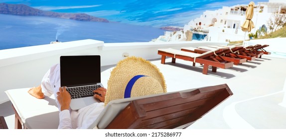 Nomad digital in a vacation working freelancer as remotely with bright scenic view of the Mediterranean Sea and Santorini caldera -work vacation concept - Shutterstock ID 2175286977