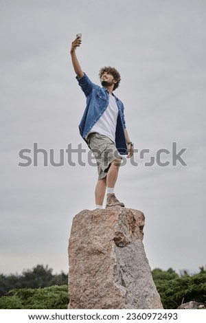 Similar – Image, Stock Photo black haired man posing with sunglasses