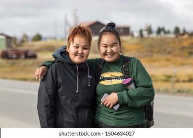 Nome, Alaska, USA - September 10th, 2019: Portrait Of Two Native Inuit - Eskimos Women Looking Camera, Outdoors On Seppala Dr In Nome, Alaska.