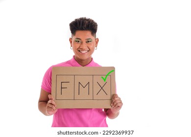 non binary asian person smiling in pink shirt holding gender non binary support sign on white background - Shutterstock ID 2292369937