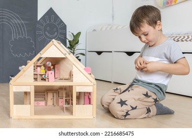 Non Binary Diverse Male Kid Playing Wooden Dolls House Enjoy Happy Childhood At Home Room Interior. Baby Boy Early Development Toy Game Girlish Plaything. Gender Individuality Freedom Choice Tolerance